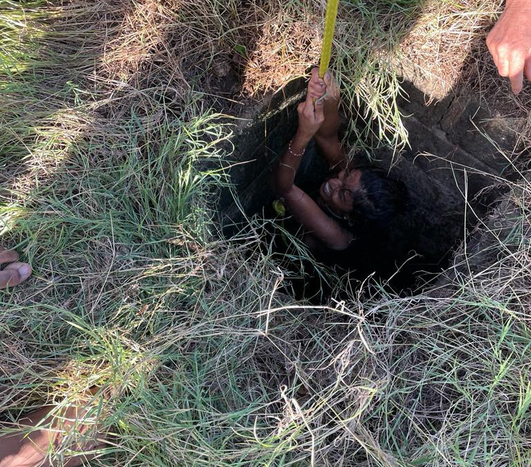 A tourist was rescued after falling into a septic hole.