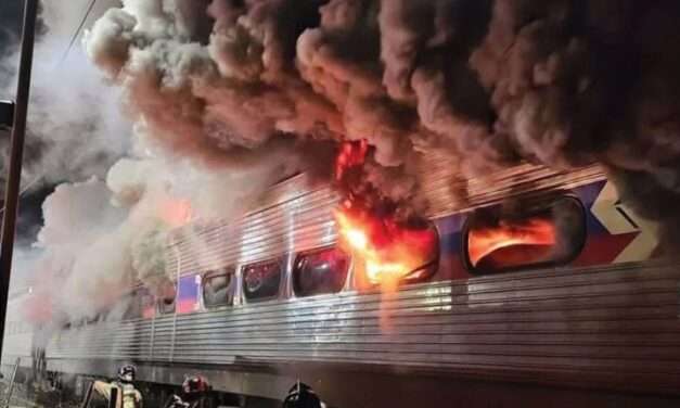 Train carriage catches fire with 350 people on board