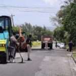 Maintenance workers begin patching efforts on Buckleys main road