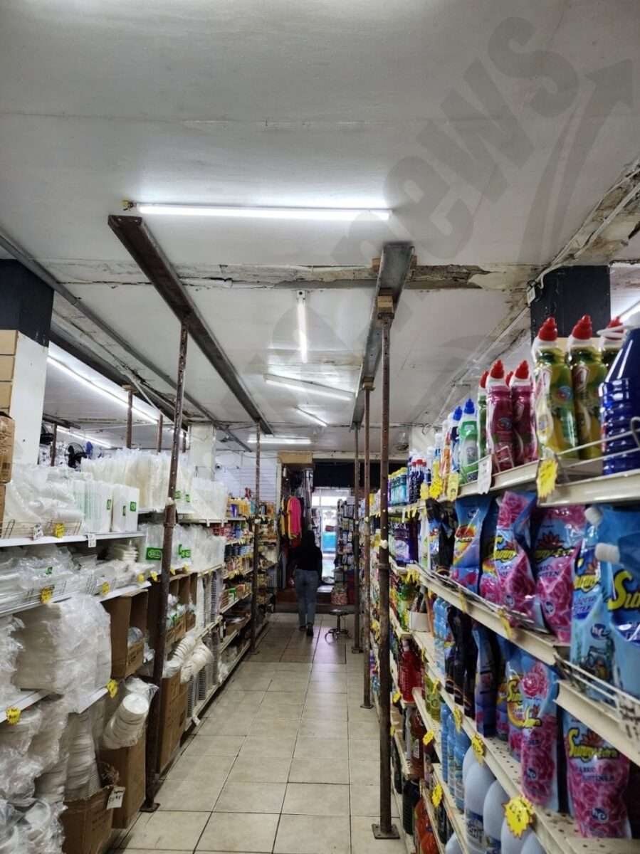 Disaster Looms: Construction Jacks Support Collapsing Roof at St. John's Business