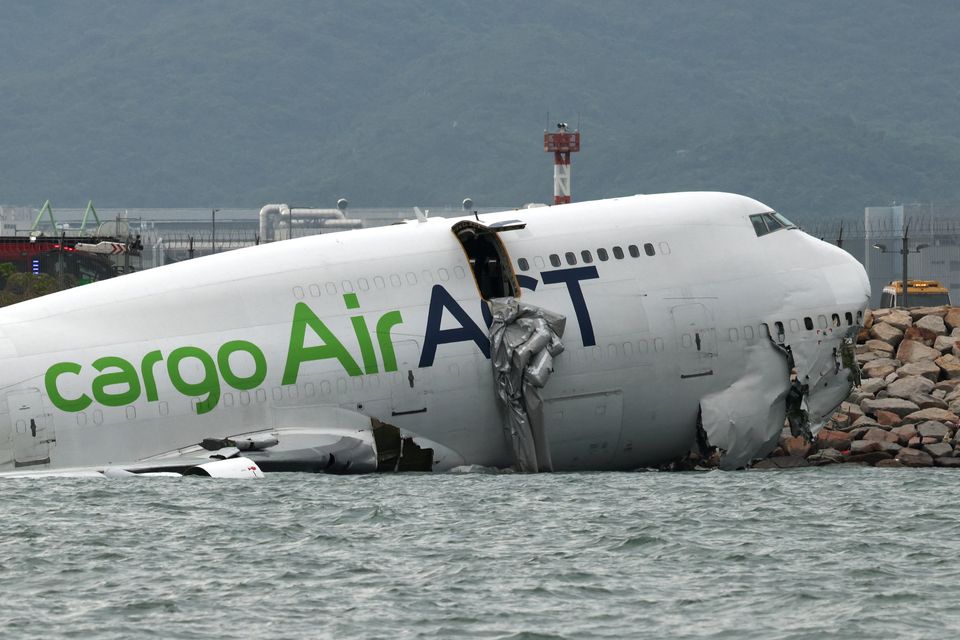 Plane skids off Hong Kong runway killing security staff