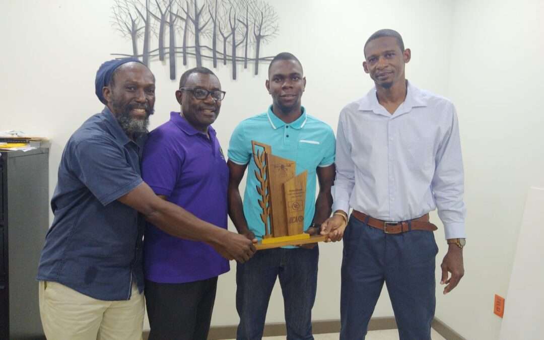 Young Farmer Presented with Cheque After Winning CARICOM Young Farmer Award