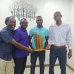 Young Farmer Presented with Cheque After Winning CARICOM Young Farmer Award