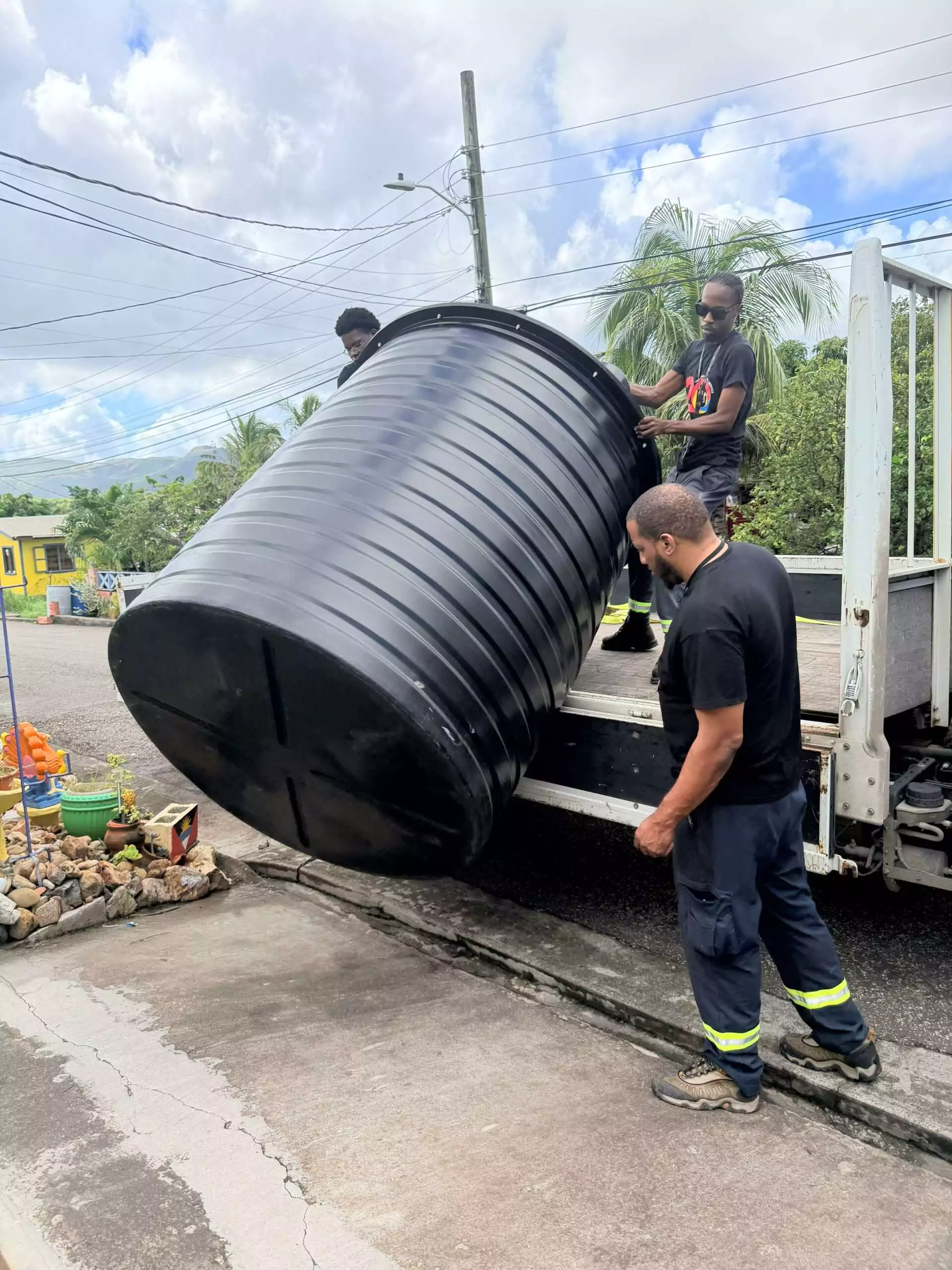 APUA Delivers Water Storage Tanks and Pumps to Winners of Christmas Promotion